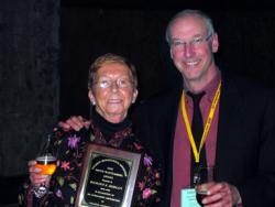 Heather Morlan accepting the award on Dick's behalf from Jack Brink Heather Morlan and Jack Brink